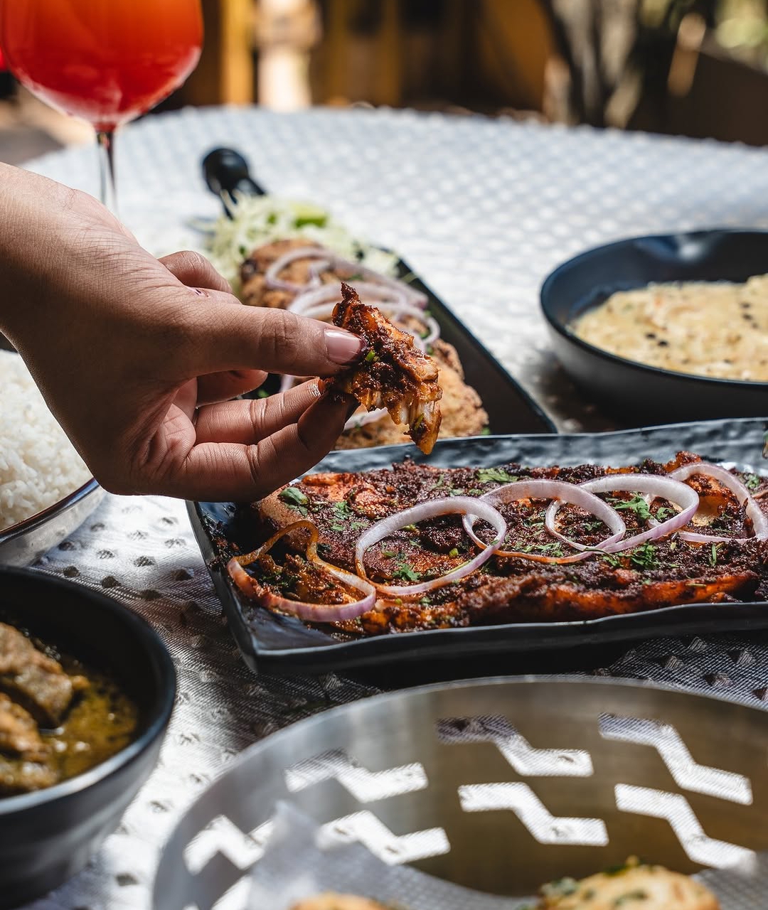 Tandoori platter spread with cocktails