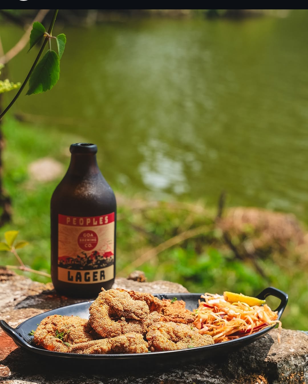 Rava-fried seafood with Peoples Lager by the lake