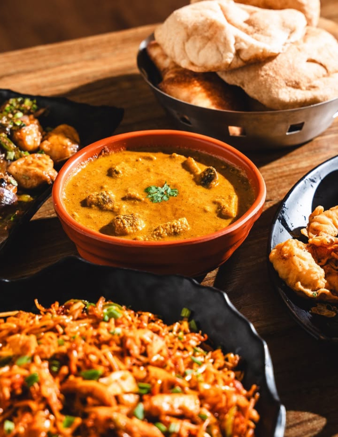 Goan curry, puris and chilli fry feast