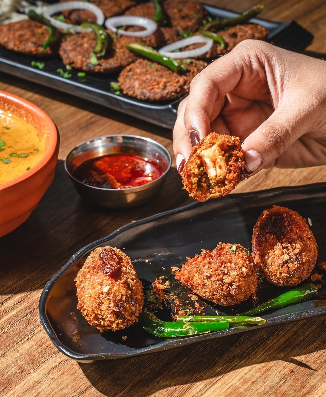 Cheese-stuffed kebab bites with chutneys